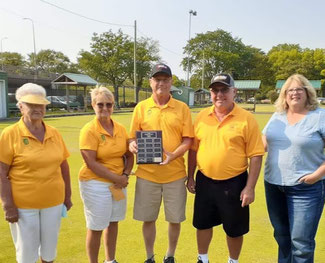 Photo of tournament winners Mary Whitson, Fran Badder, Les Badder and Jerry Meyskens with sponsor Linda Hudson. Les Badder is holding the championship plaque. 