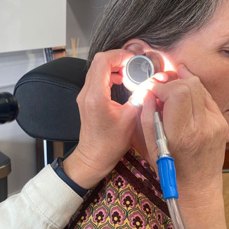 Live suctioning of earwax in a training room at Liverpool Hearing Centre