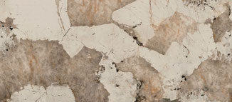 Dekton Khalo, évoquant la richesse du granit de Patagonie. Ses nuances de noir, d'or pâle et de marron café créent un contraste saisissant et élégant.