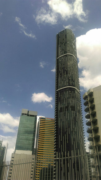 view from bus terminal in brisbane big skyscraper, clouds and sky