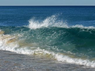A wave breaking on Coila Beach