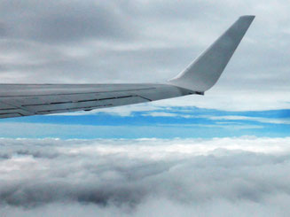 Wing, sky, and cloud