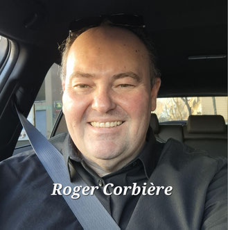 photo du visage de Roger Corbière avec le sourire dans sa voiture de VTC avec ceinture de sécurité.