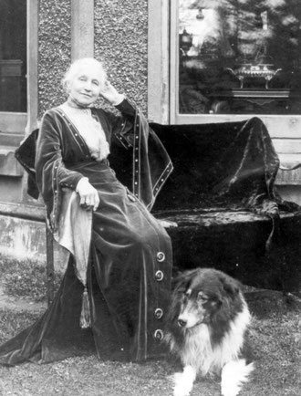 Mary Walker at the Hall with her dog Laddie, probably 1920s