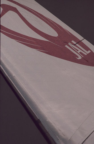 A B747 tailfin with JAL's familiar crest.