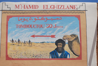 Schild "Timbuktu 50 Tage" in M'Hamid, Ausgangspunkt unserer Wüstentouren