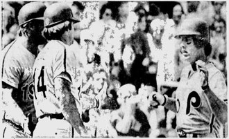 Mike Schmidt is greeted at home by Pete Rose and Greg Luzinski following his 40th homer in the first inning.