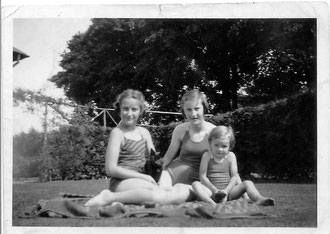 Sheena and Margaret Swanney with cousin Eleanor Swanney and cat, about 1939-1940, possibly at Marybank, Croy, Inverness-shire. Photographer unkown.