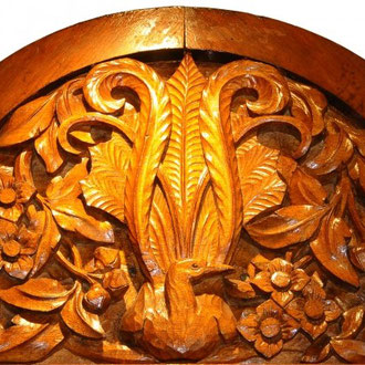 (DR) John Grant's carving of a lyrebird and clematis. It is one of 16 panels in the school hall at Villers-Bretonneux. Photo: Courtesy Amanda Wescombe