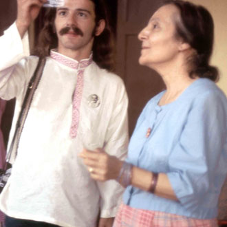 1975 Meherazad : Mehera with Anthony Zois are admiring Meher Baba's hair that she gave him as a love gift. Photo taken by Sher DiMaggio Zois