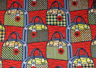 Tissu africain wax au motif du sac de Michelle Obama sur fond rouge