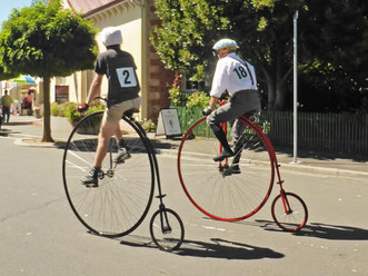 Two penny-farthing cyclists