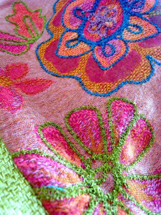 Detail of thick, colourful woollen embroidery 