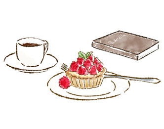 イチゴタルトのお皿、コーヒーのカップ＆ソーサ、本が並んでいる。