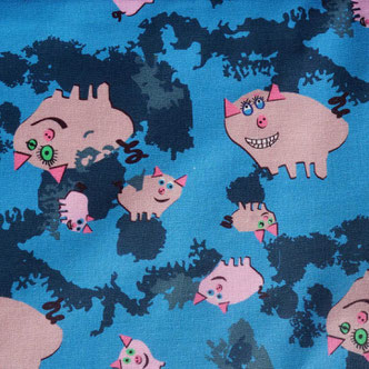 Fabric with the motif "pigs in the mud"