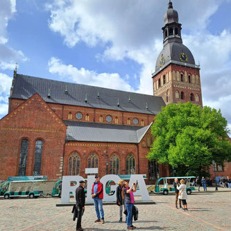 Dome Cathedral in Riga's Old Town with tourists in foreground