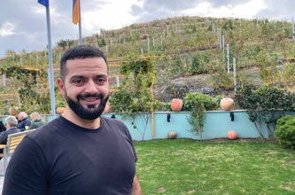 A beaming Musho, proud of his prize-winning family vineyard.
