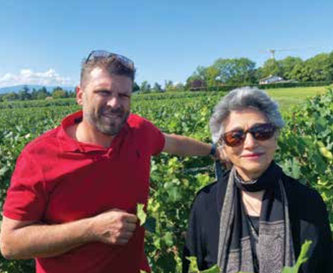 Above: Christian Dutruy with Reva K. Singh. Below: View of Les Fréres Dutruy vineyards with Lake Geneva in the background