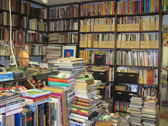 Kampintorin Antikvariaatti - owner Timo Surojegin surrounded by some of his 40,000 books