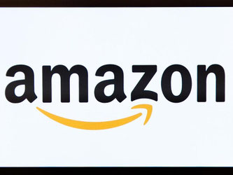 Das Logo des Internethändlers Amazon ist auf einem Display zu sehen. Foto: Sebastian Kahnert/Archiv