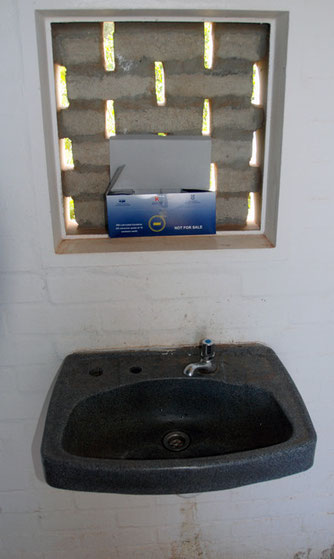 In 2007 2,000 Imizamo Yethu residents were lving with HIV/AIDs: free condoms in a public toilet on the Cape Peninsula