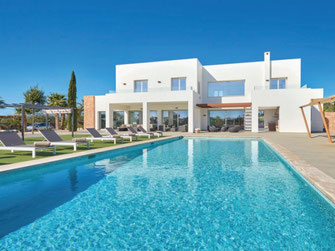 white villa with large swimming pool in Ibiza