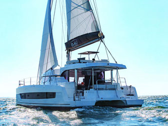 Large catamaran on the water, set sails