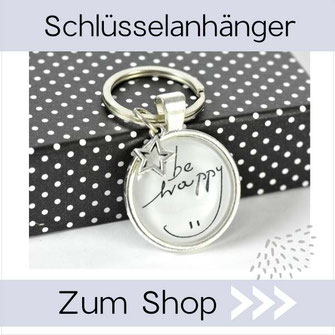 Foto mit Schlüsselanhänger mit Text: Be Happy 