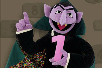 The Count from Sesame Street holding the number one