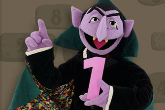 The Count from Sesame Street holding the number one