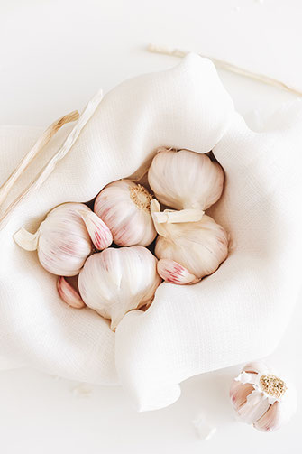 Radiant Reality Blog | Biohack and Bolster your Immune System during Flu Season - Garlic Mullein Ear Oil | Garlic