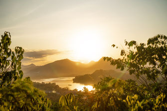 Sunset at Mount Phou Si overlooking the Mekong River and the mountains.