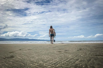 Surfers on the beach of Santa Catalina.