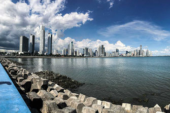 Panama City on the shore of the sea with gathering clouds.