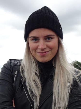 Handknit wool and alpaca black hat styled outdoor.
