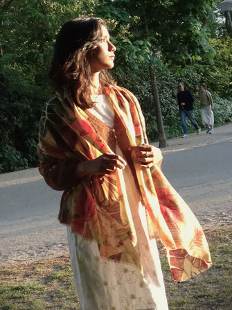 Lightweight wool shawl with nature motifs styled