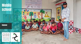 Pupils sitting in a class room in India as part of GoodTextiles Foundation's mobile school project