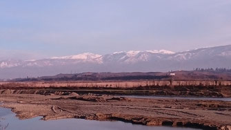 Snow-capped mountains on the road from the Black Sea to Ozurgeti, 11/02/2016.
