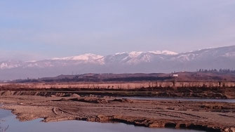 Snow-capped mountains on the road from the Black Sea to Ozurgeti, 11/02/2016.