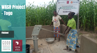 Two women getting water from a new water pump in Africa