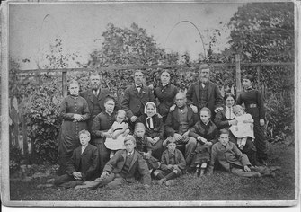 Thought to be a family photo taken in garden of David Symon and Elizabeth Kelt's house opposite Bower View, High Street, Errol, on occasion of their 50th wedding anniversary, 1879.  
