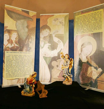 Bis zum Weihnachtsfest sehen wir an der Stelle, an der unsere Krippe aufgebaut sein wird, die Szene von der Verkündigung der Geburt Jesu an Maria.