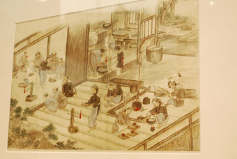 明治中頃、津軽での祝の席の様子を描いたもの。こぎん刺しの着物を着た人が描かれている。
