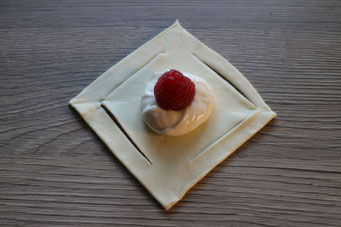 puff pastry square with cream cheese filling and raspberry