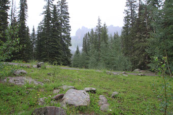 In "True Grit", Rooster (John Wayne) makes camp on the summit of Owl Creek Pass, with Cimarron Range" in the background. 