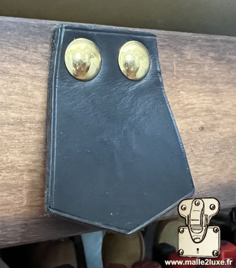 TL leather pull tab for wardrobe trunks and interior compartments.