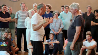 Patrick Kelly explaining something to the Taiji group at the workshop.