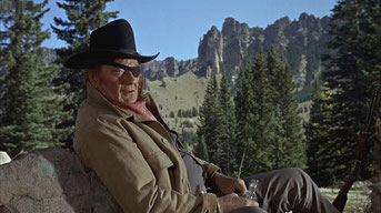 Rooster (John Wayne) makes camp on the summit of Owl Creek Pass, with Cimarron Range" in the background. 