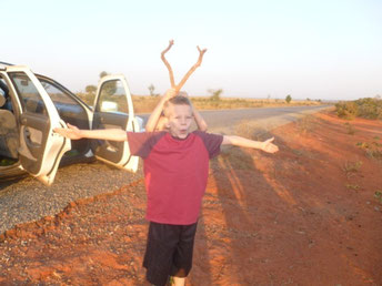 Roadside stop on our way to Abuja (Caleb helped with the antlers)