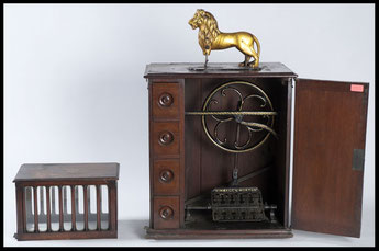 Metal and wood 'Lion' sewing machine, cabinet model made by Messrs Kimball & Morton Ltd, Glasgow, 1903